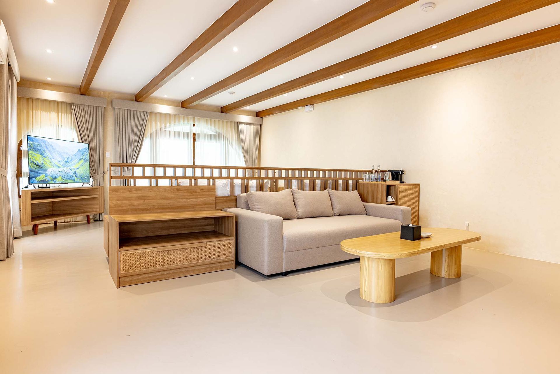 Beach Villa living area with wooden beams at Costa Solana Resort, Pagbilao, Quezon