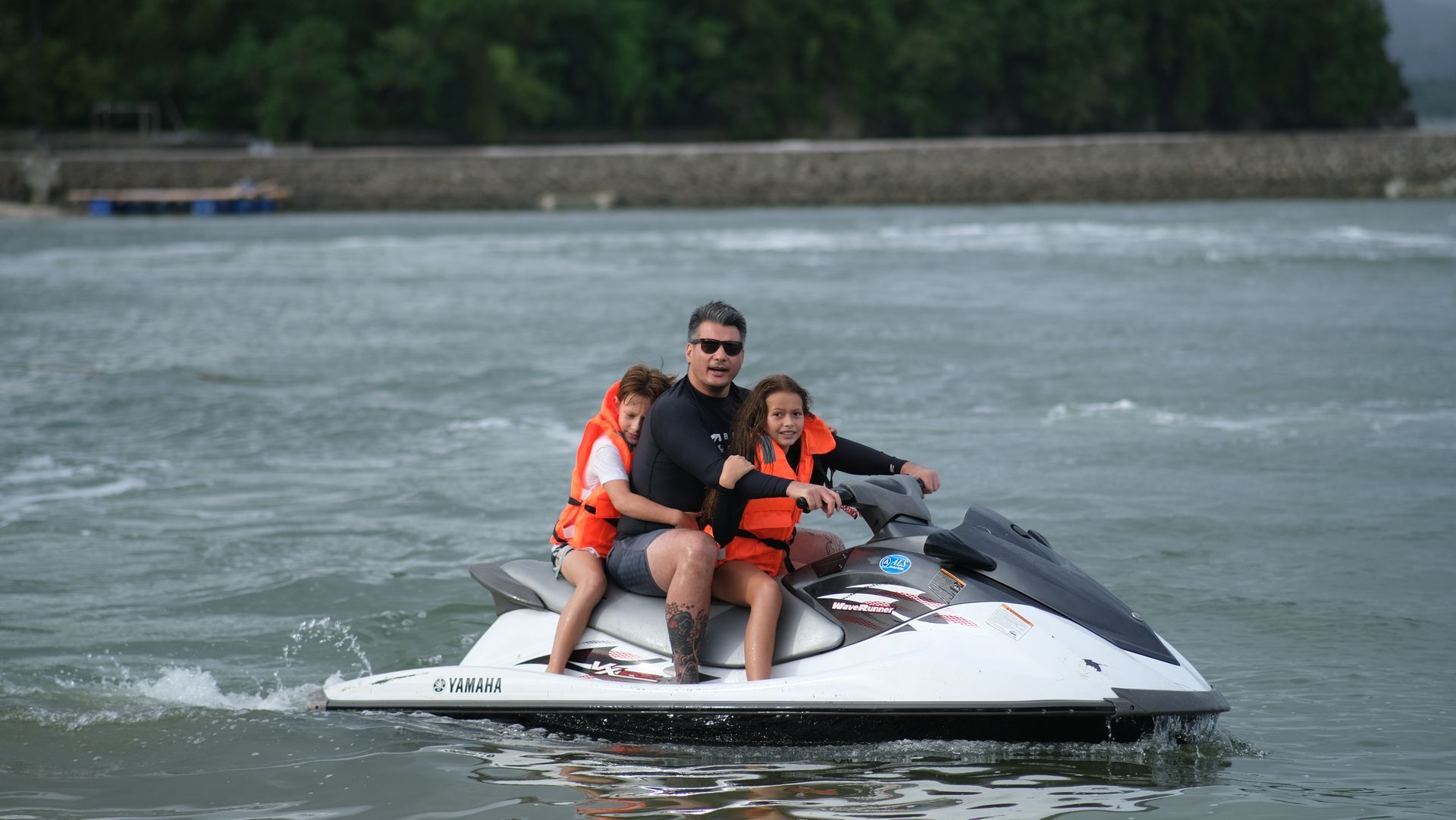 Family riding Yamaha WaveRunner jet ski at Costa Solana Pagbilao beach resort