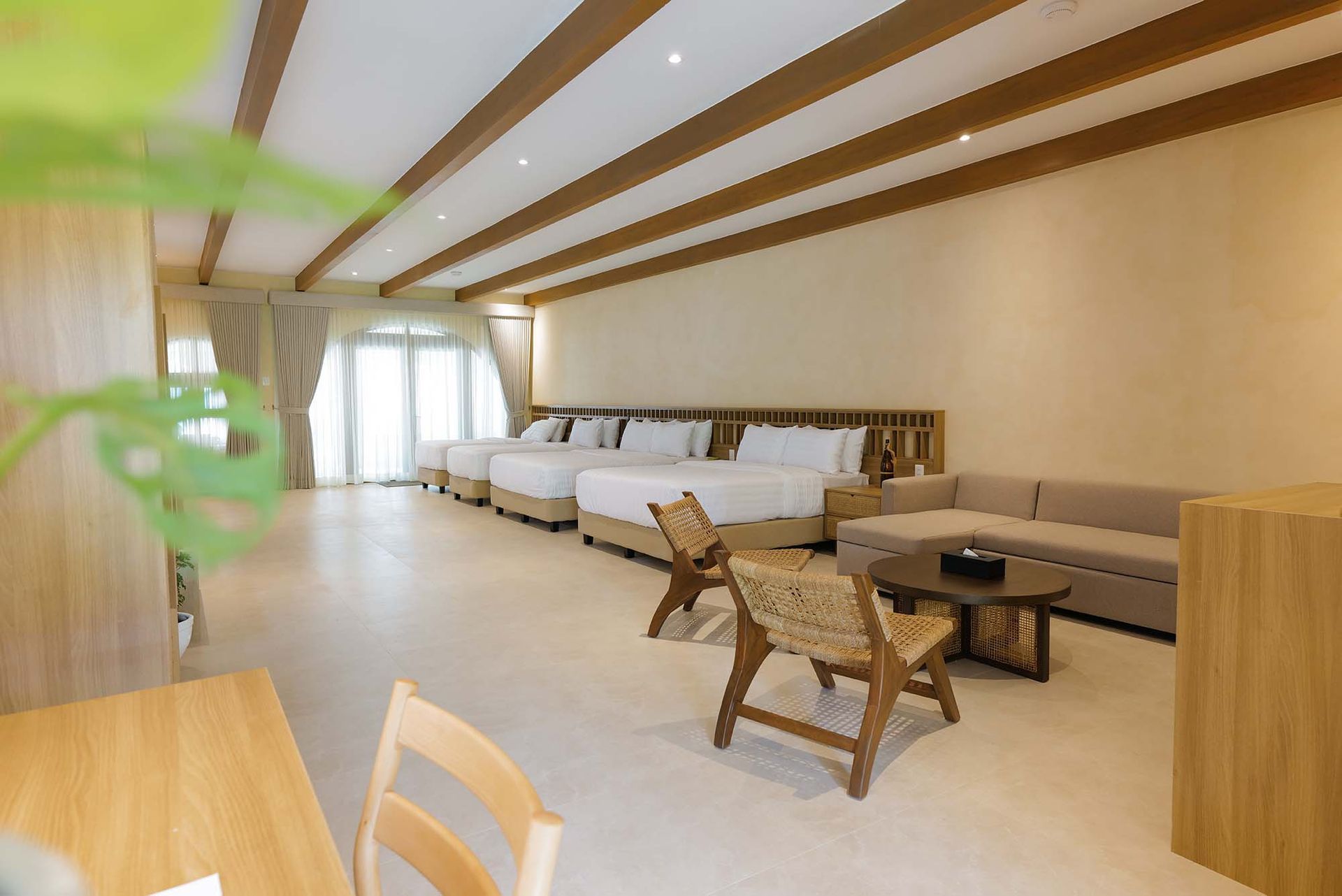 Family Beach Villa living area with wooden ceiling beams at Costa Solana Resort, Pagbilao, Quezon