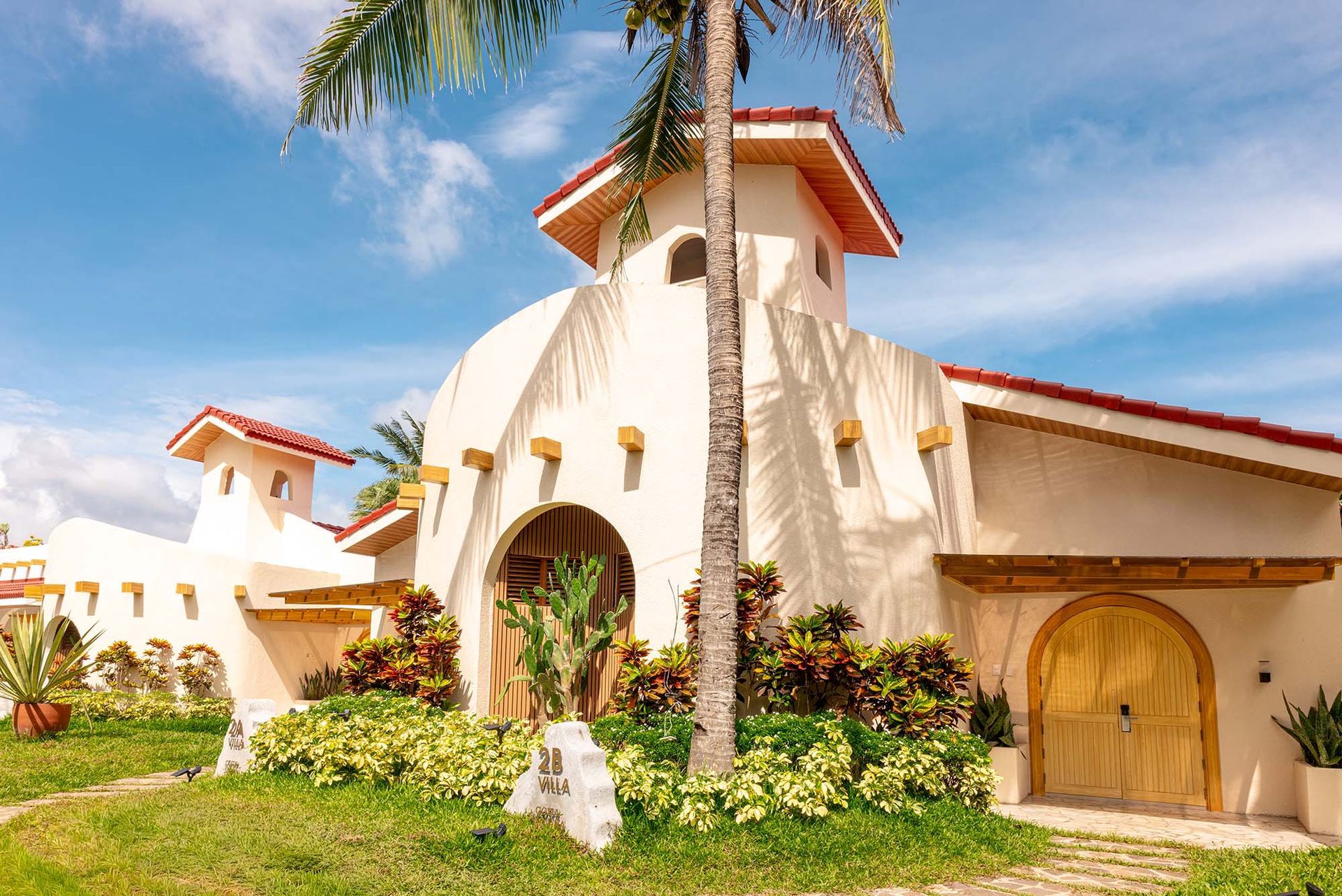 Family Beach Villa exterior facade with tropical landscaping at Costa Solana Resort, Pagbilao, Quezon