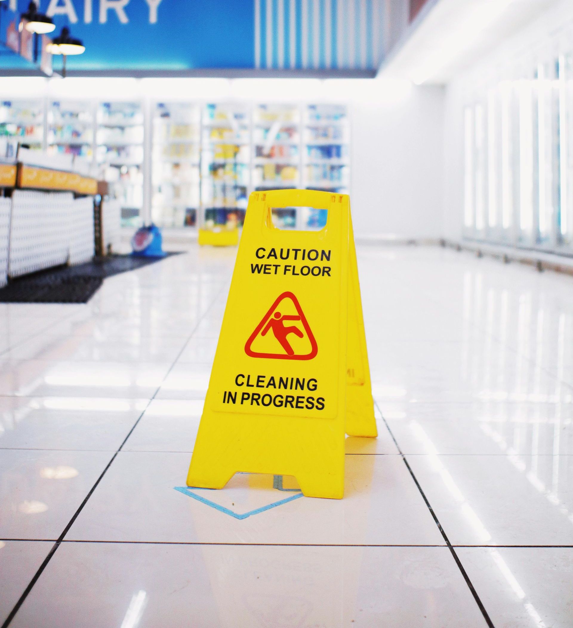 A yellow sign that says caution wet floor cleaning in progress