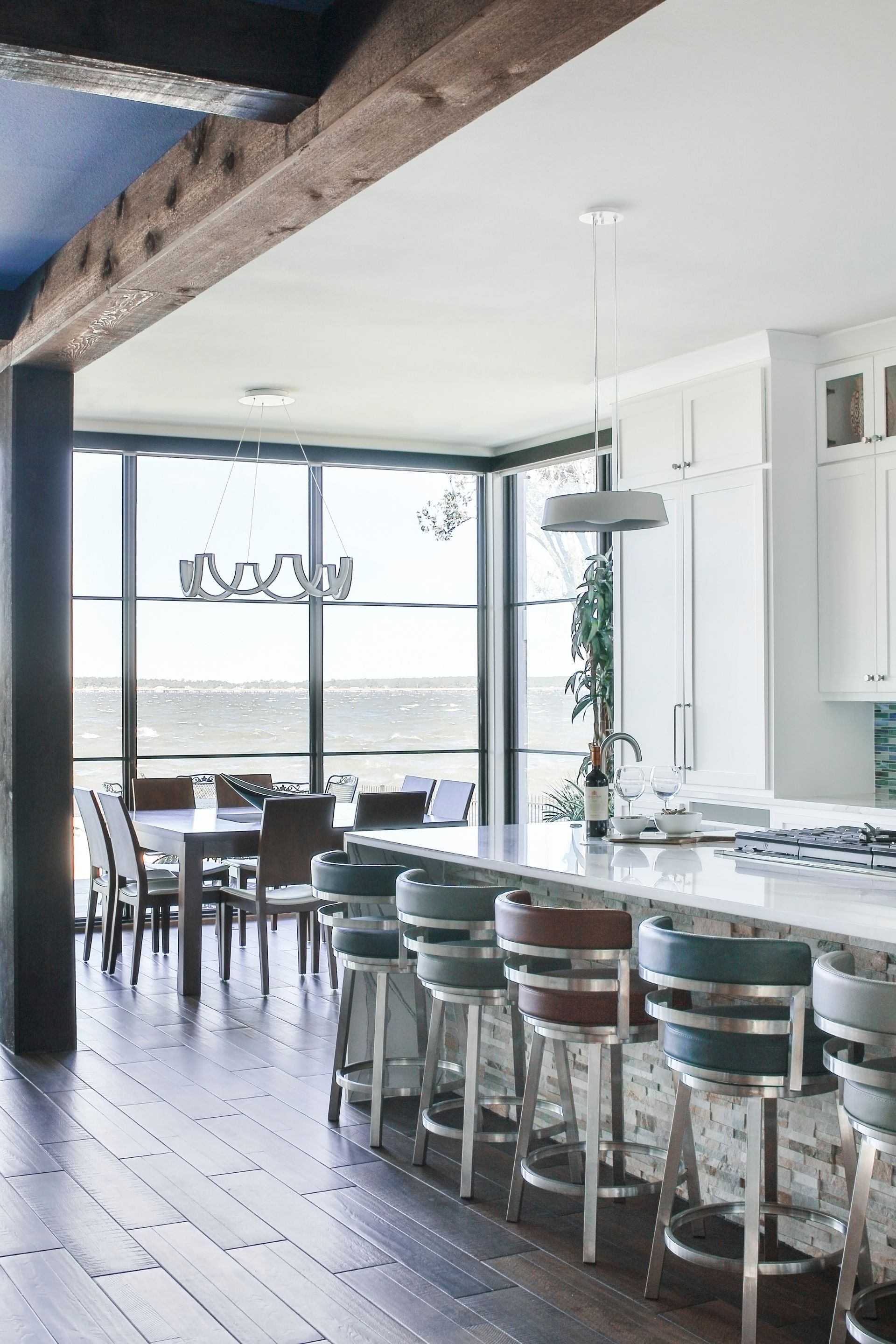 A kitchen with a large island and stools