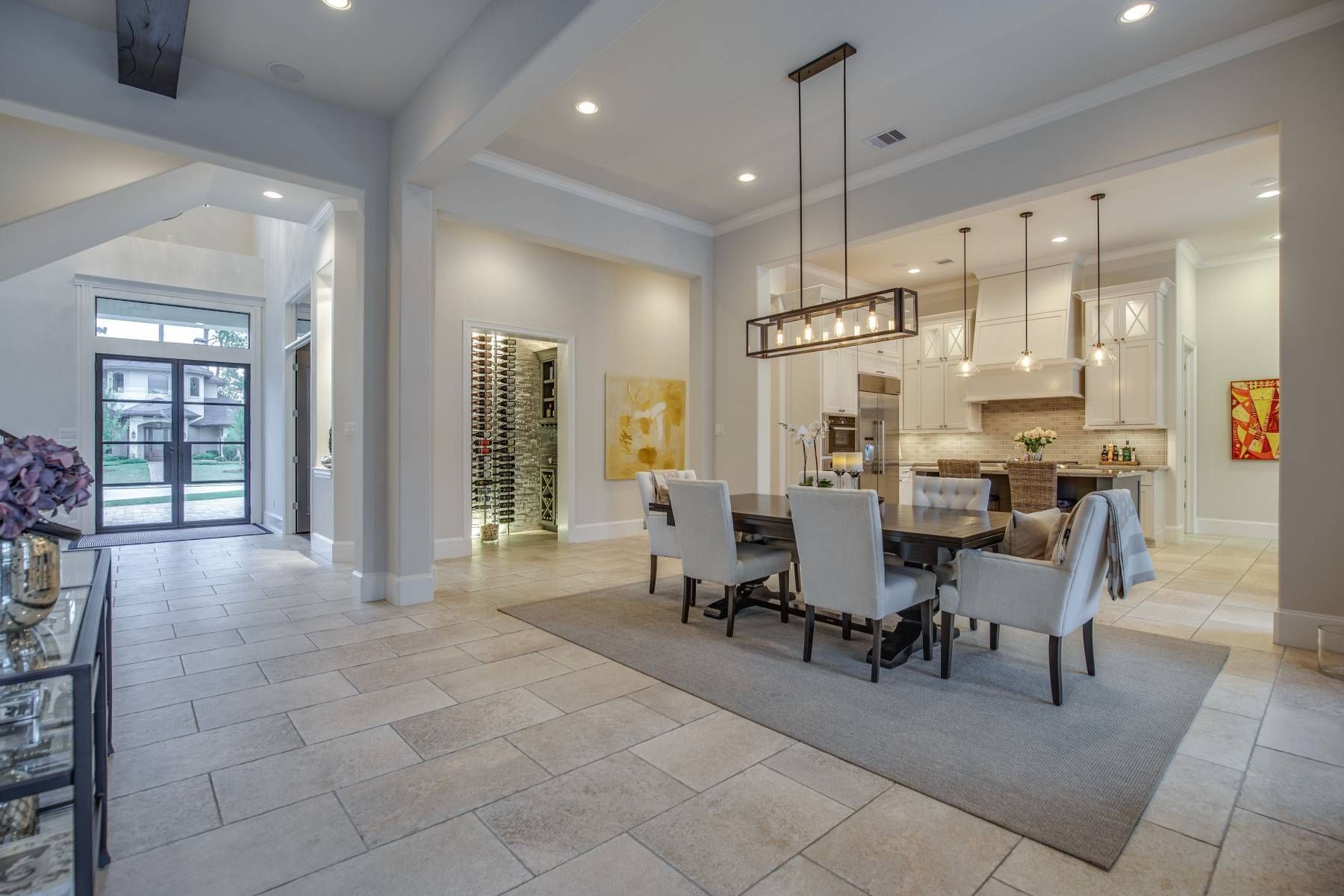 A dining room in a house with a table and chairs