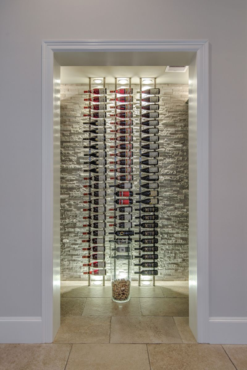 A wine cellar filled with lots of bottles of wine and corks.