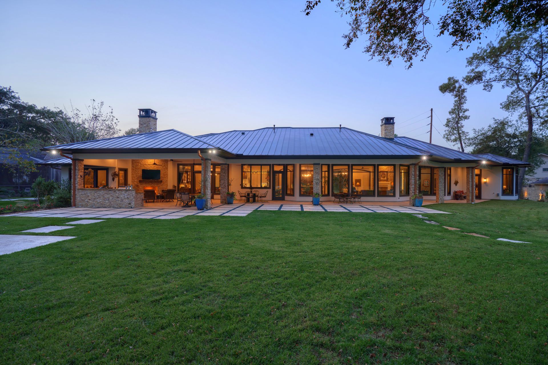 A large house with a large lawn in front of it