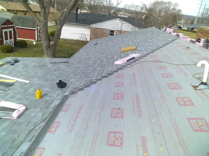 A shingle roof installation in Hamilton, OH - Haubner Construction hard at work