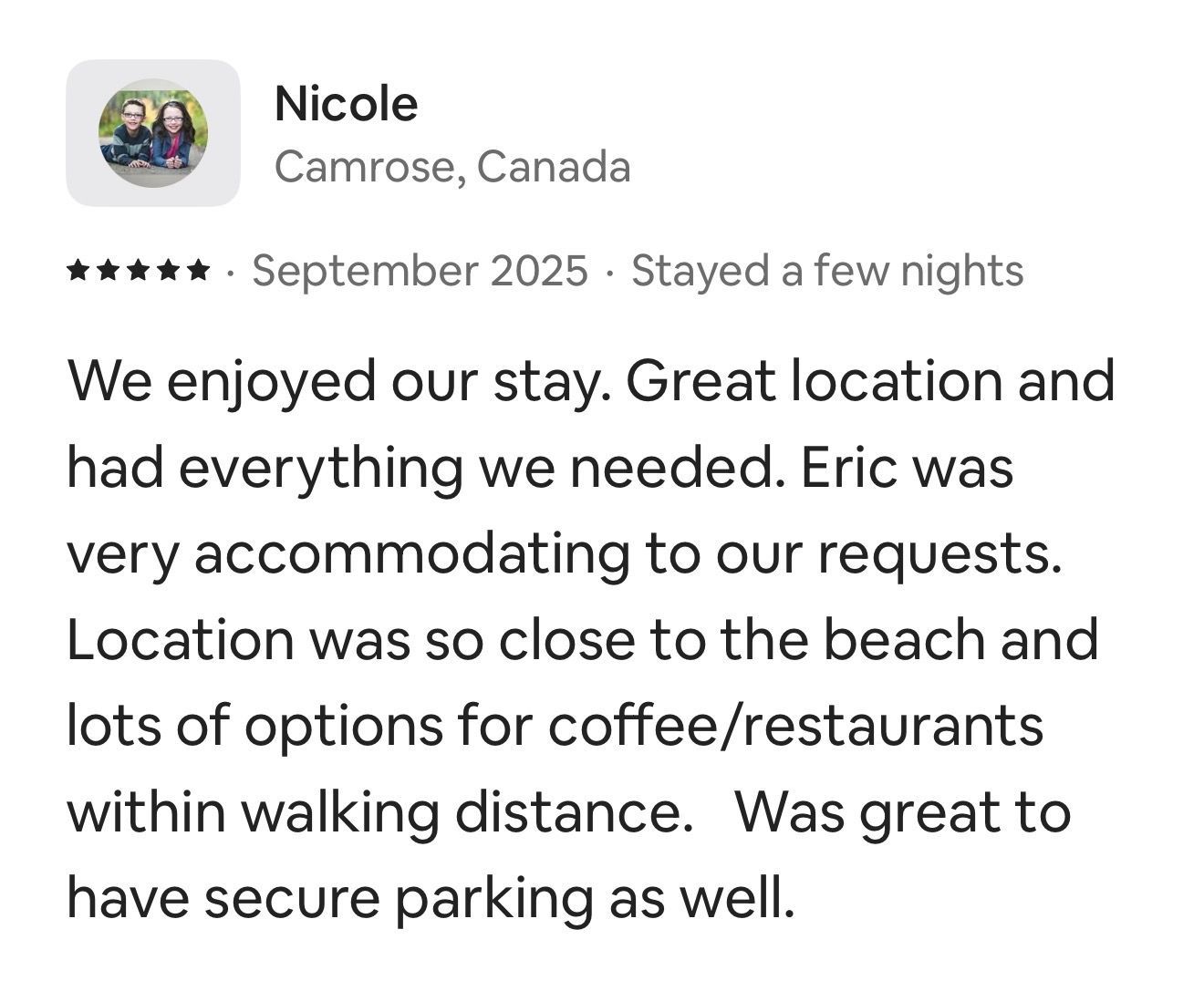 A 5-star review from Nicole in Camrose, Canada, praising the location, amenities, host Eric, and secure parking.