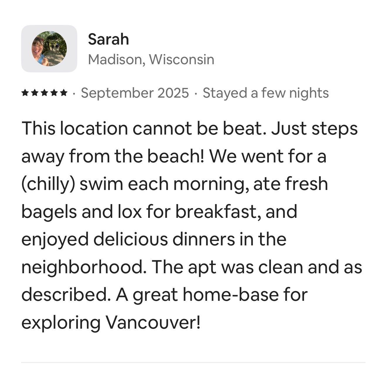 A 5-star review from Sarah of Madison, Wisconsin, describing a clean Vancouver apartment near the beach.