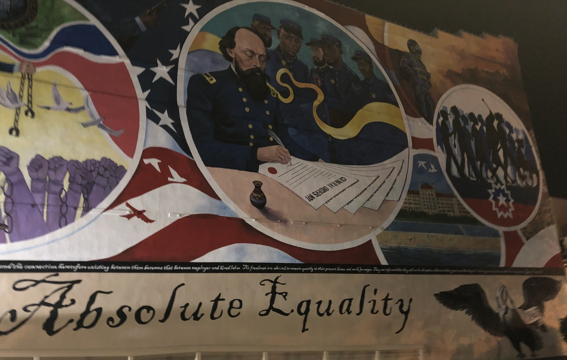 Juneteenth mural with army general, Black American soldiers, and formerly enslaved people