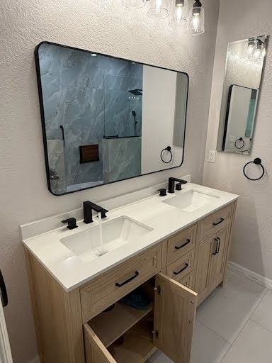 Modern bathroom vanity with double sinks, wall mirror, and open cabinet doors
