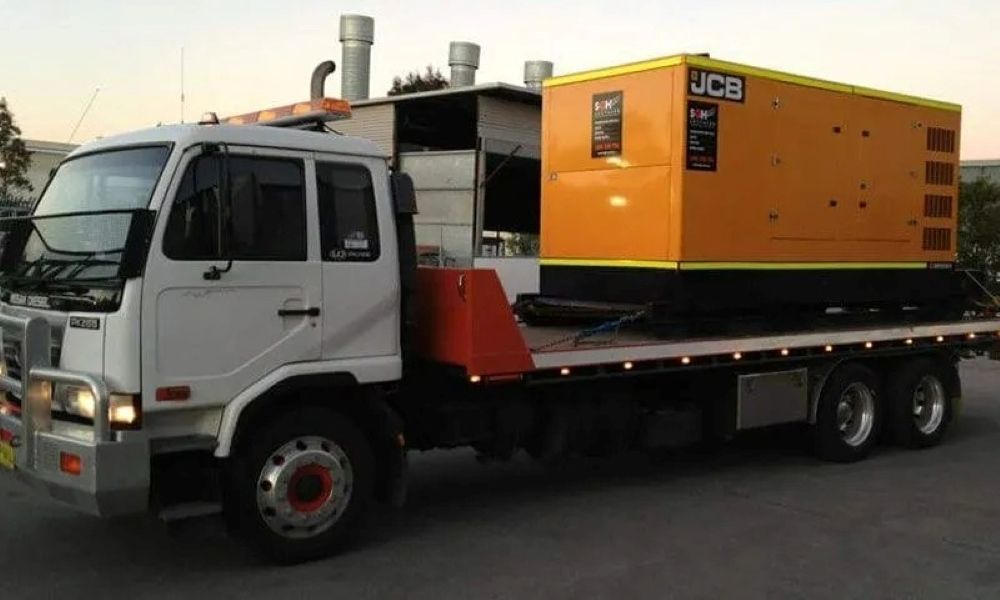 A White Truck with A Yellow Box on The Back that Says JCB — Easylift Towing NSW Pty Ltd In Beresfield, QLD