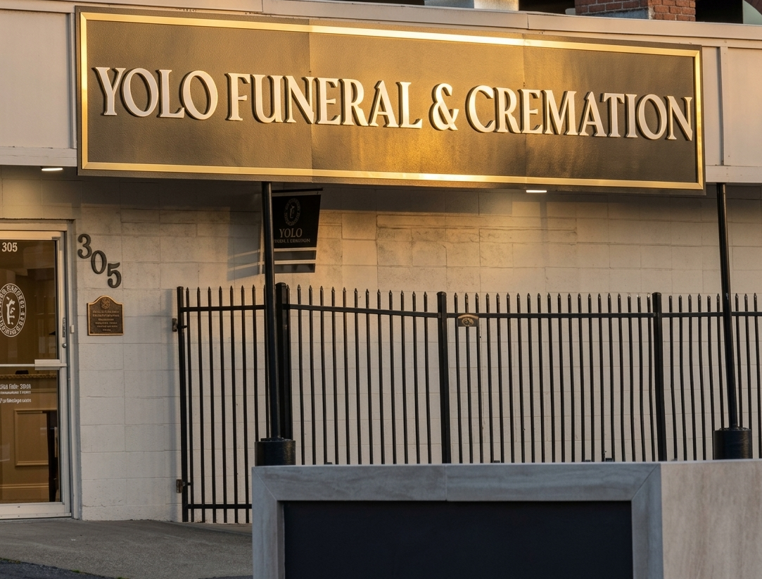 Storefront sign reading “YOLO Funeral & Cremation” above a gated entrance.