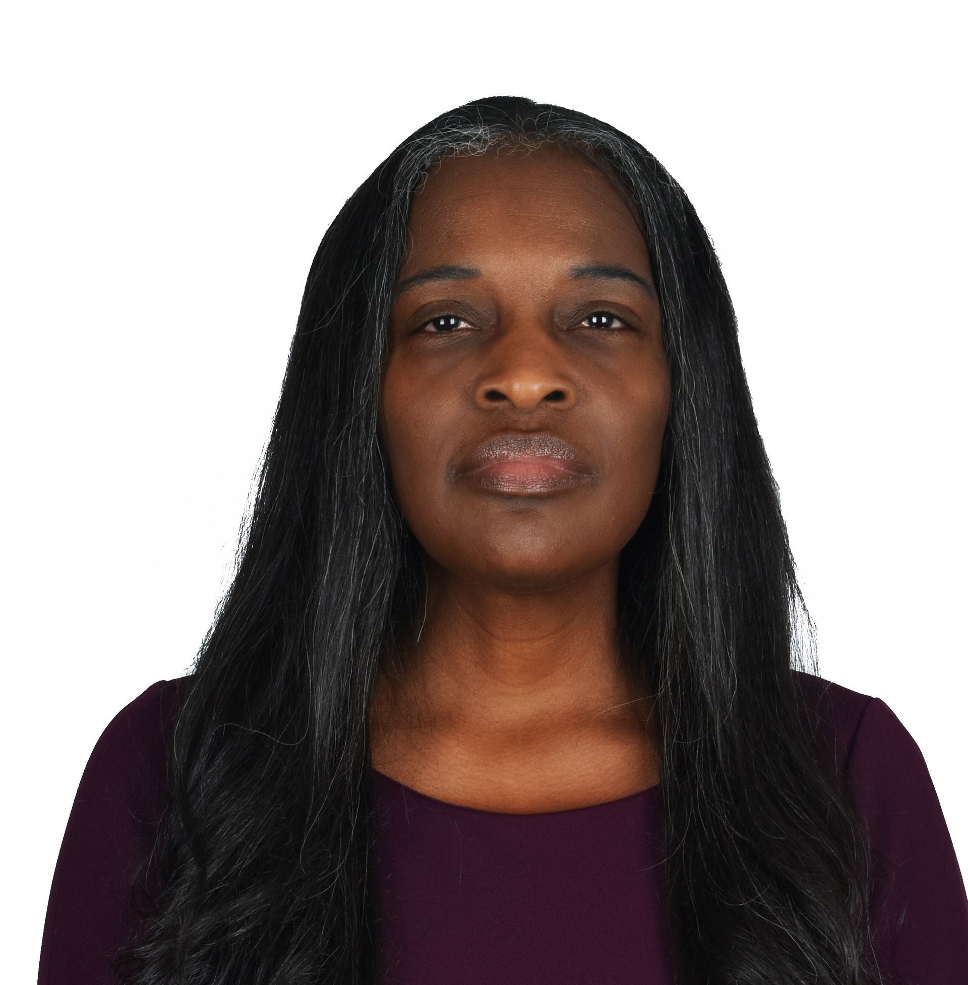 A person with dark hair and dark eyes.  