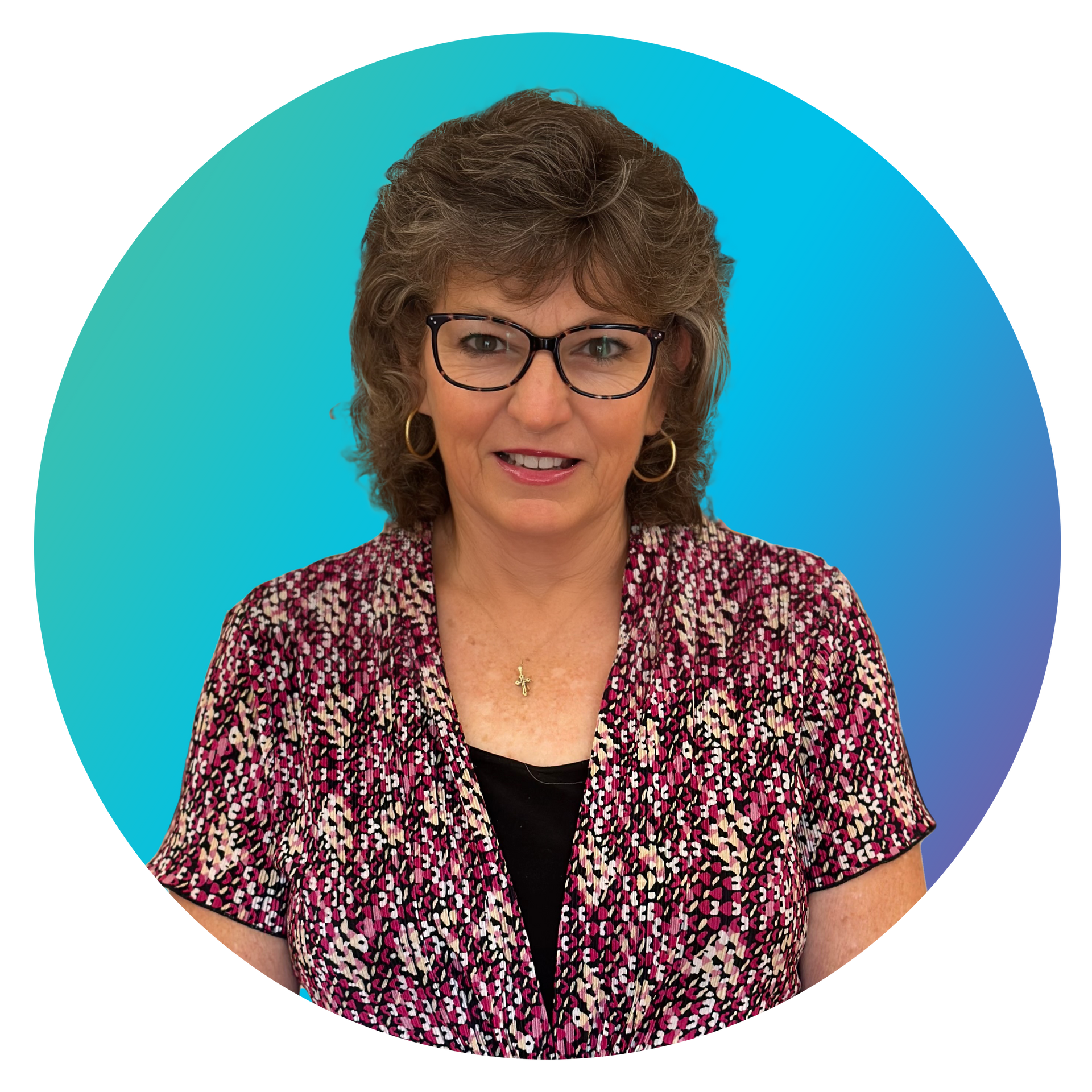 A woman wearing glasses and a floral shirt is standing in a circle.