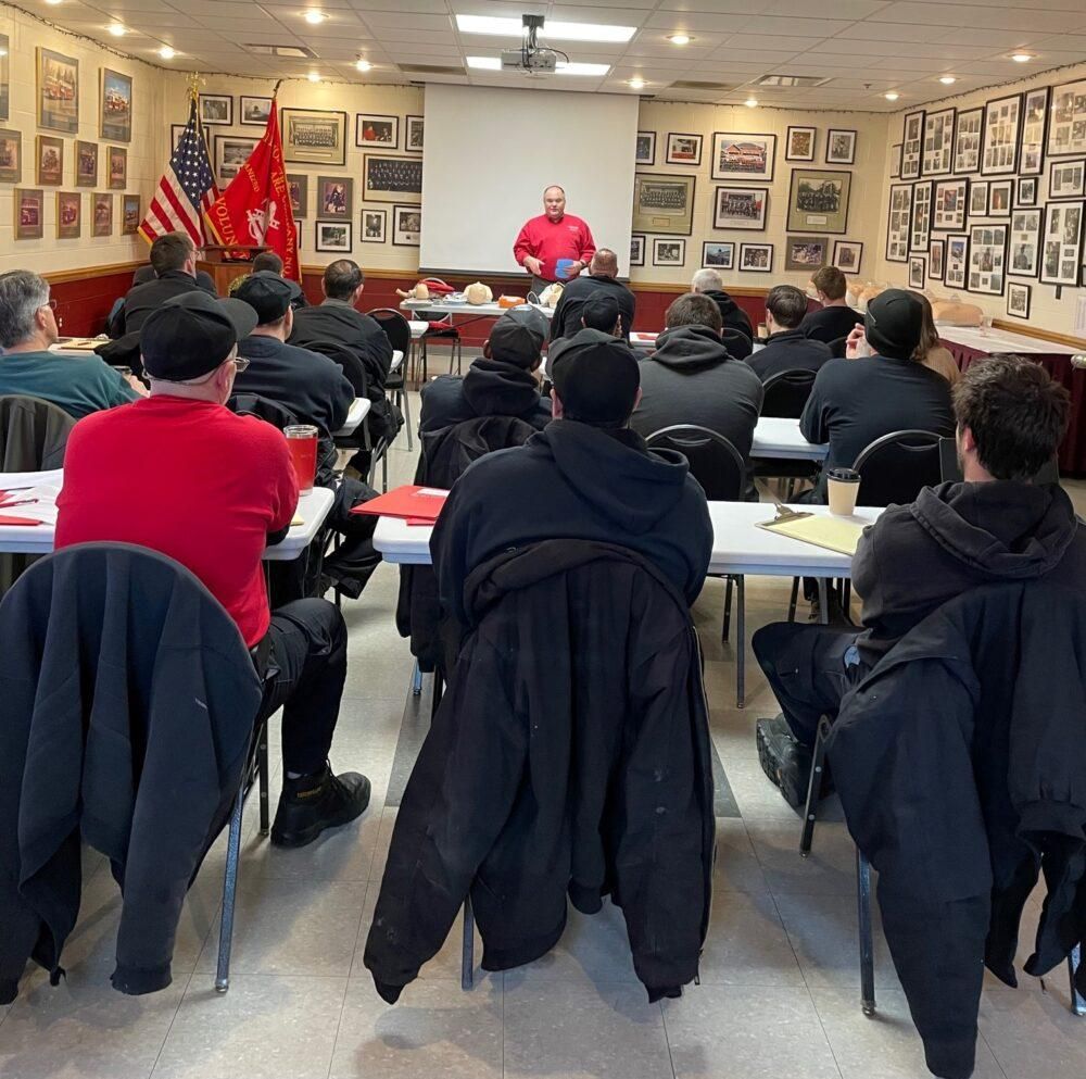 A man is giving a presentation to a group of people
