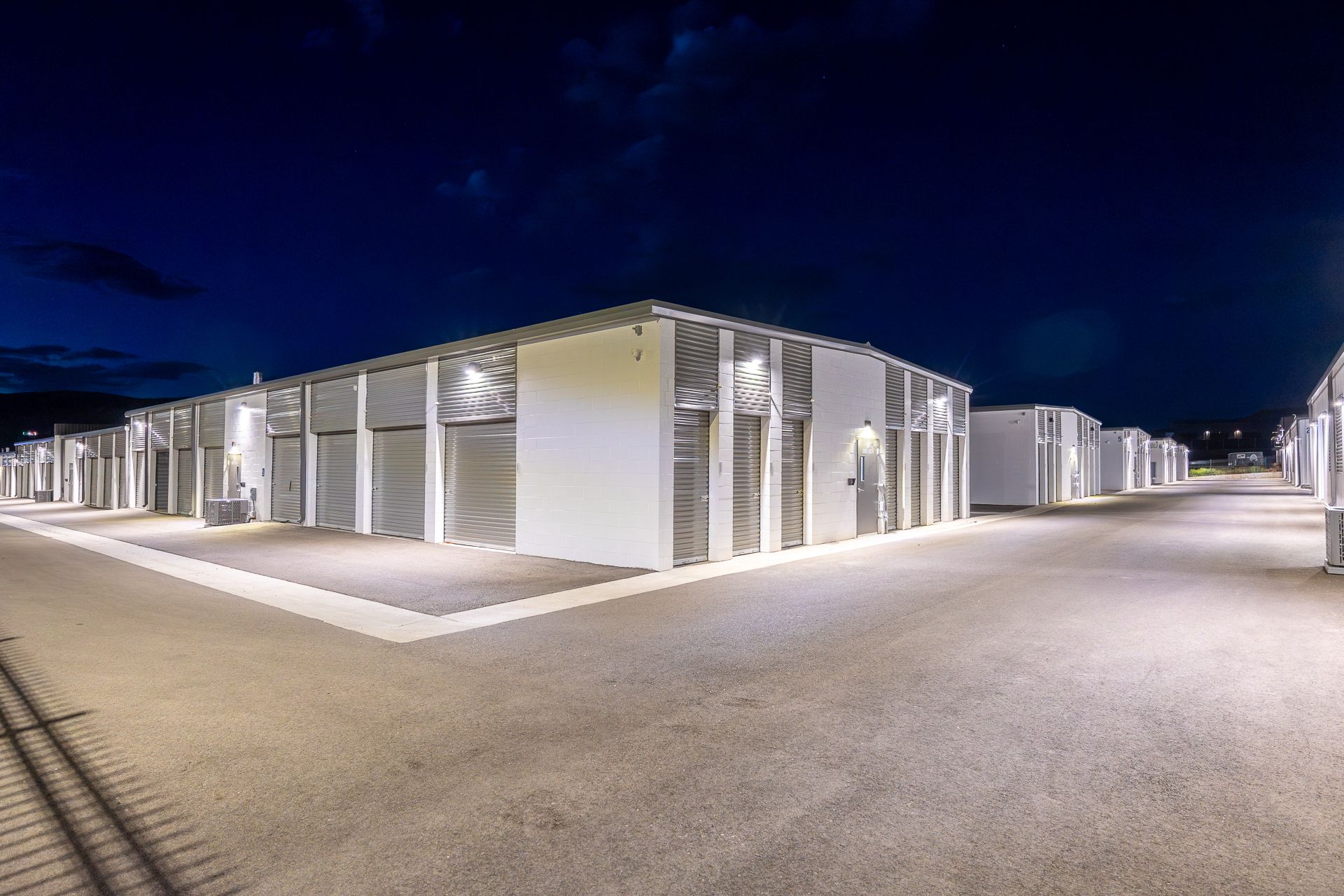 Brightly lit smart storage units at night at Vail Airport Storage