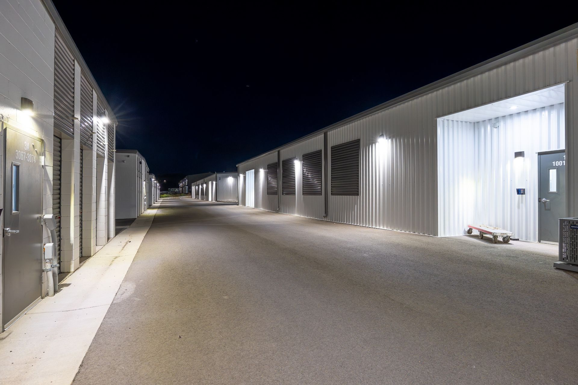Night view of the lit drive-up storage aisles in Gypsum