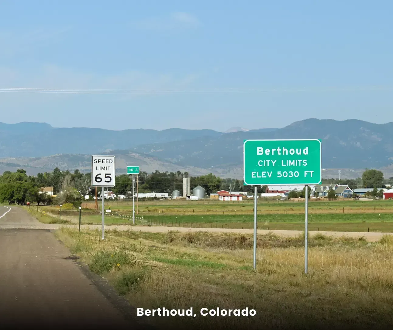 Berthoud, Colorado city limits sign along a rural road, local area served for carpet cleaning services