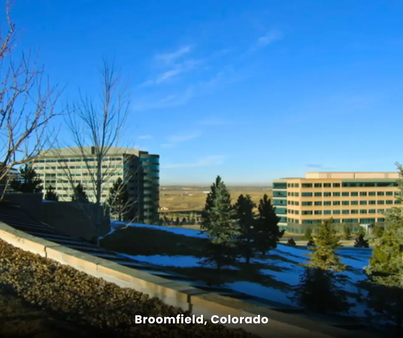Broomfield, Colorado cityscape with office buildings and mountains, service area for expert carpet cleaning services