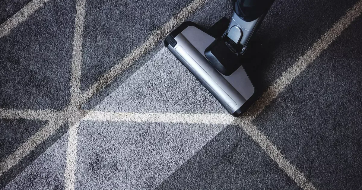 A vacuum cleaner on a carpet
