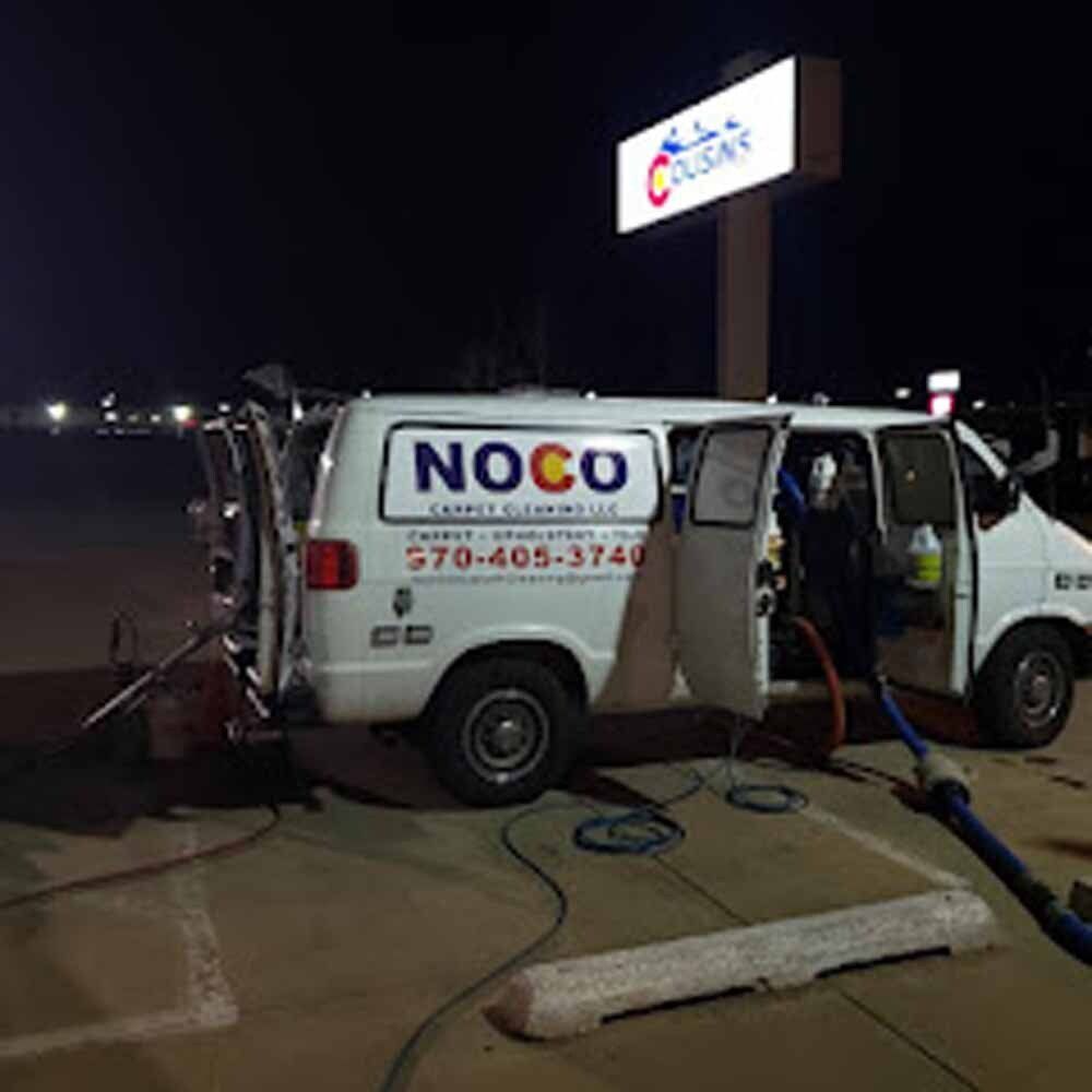 NOCO Carpet Cleaning van set up at night with hoses connected for commercial carpet cleaning service
