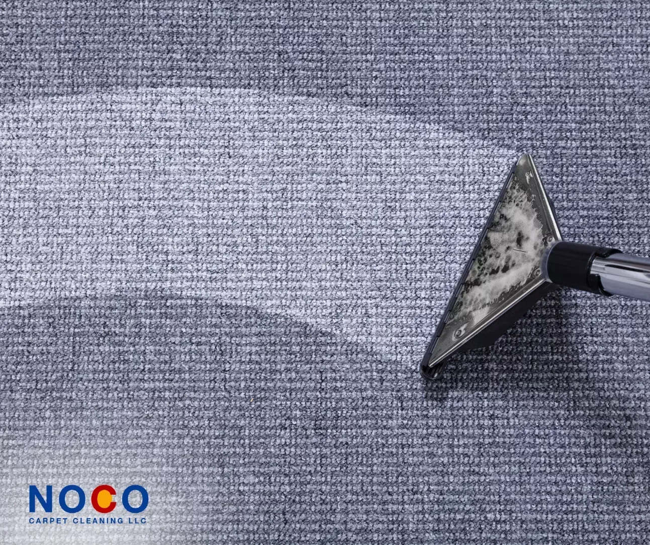 Carpet cleaning wand extracting dirt from gray carpet for a deep, professional clean
