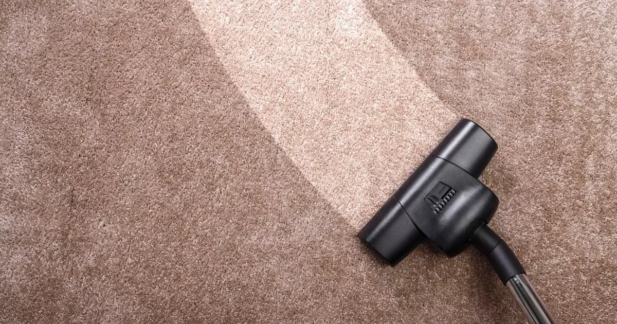 A vacuum cleaner on a carpet