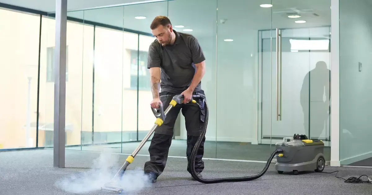 A person using a vacuum cleaner