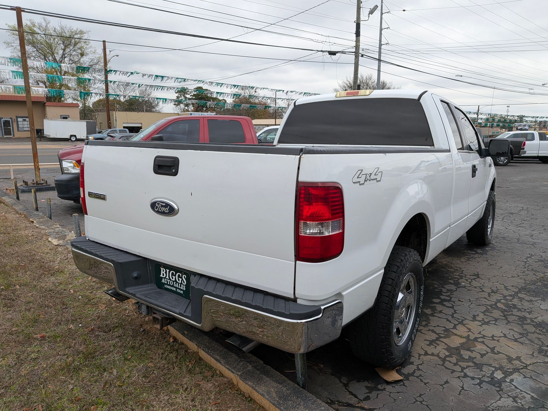 White Ford F-150 pickup truck parked outdoors, displaying a 