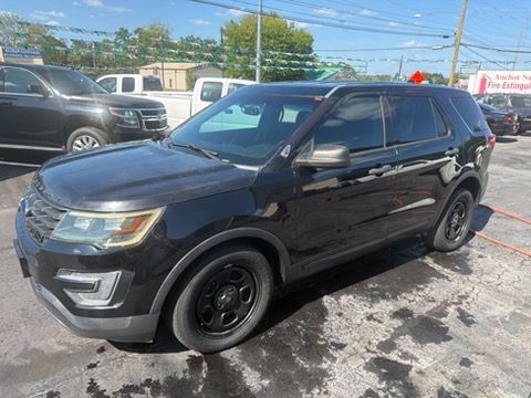 Black SUV parked at a car lot on a sunny day
