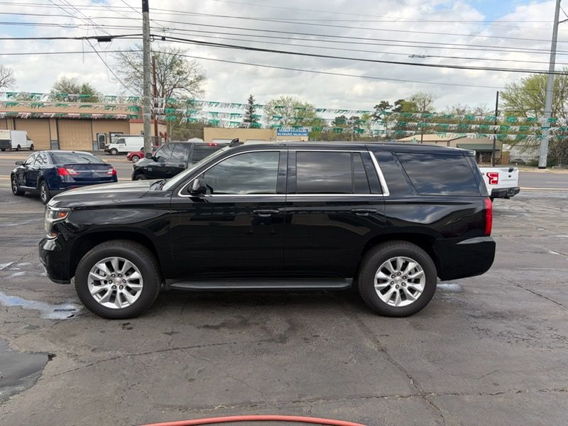 Black SUV parked in a lot on an overcast day