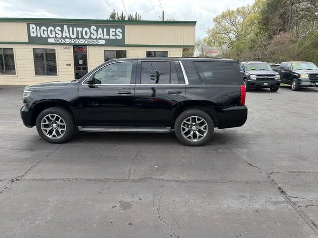 Black SUV parked in front of Biggs Auto Sales dealership