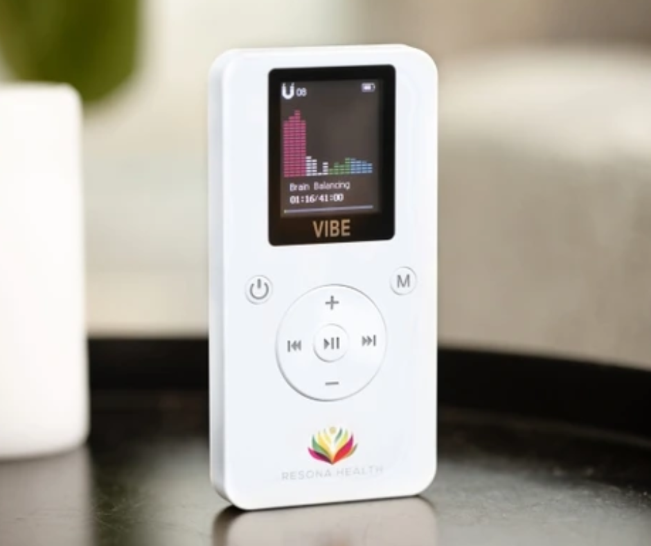 A white vibe device is sitting on a table