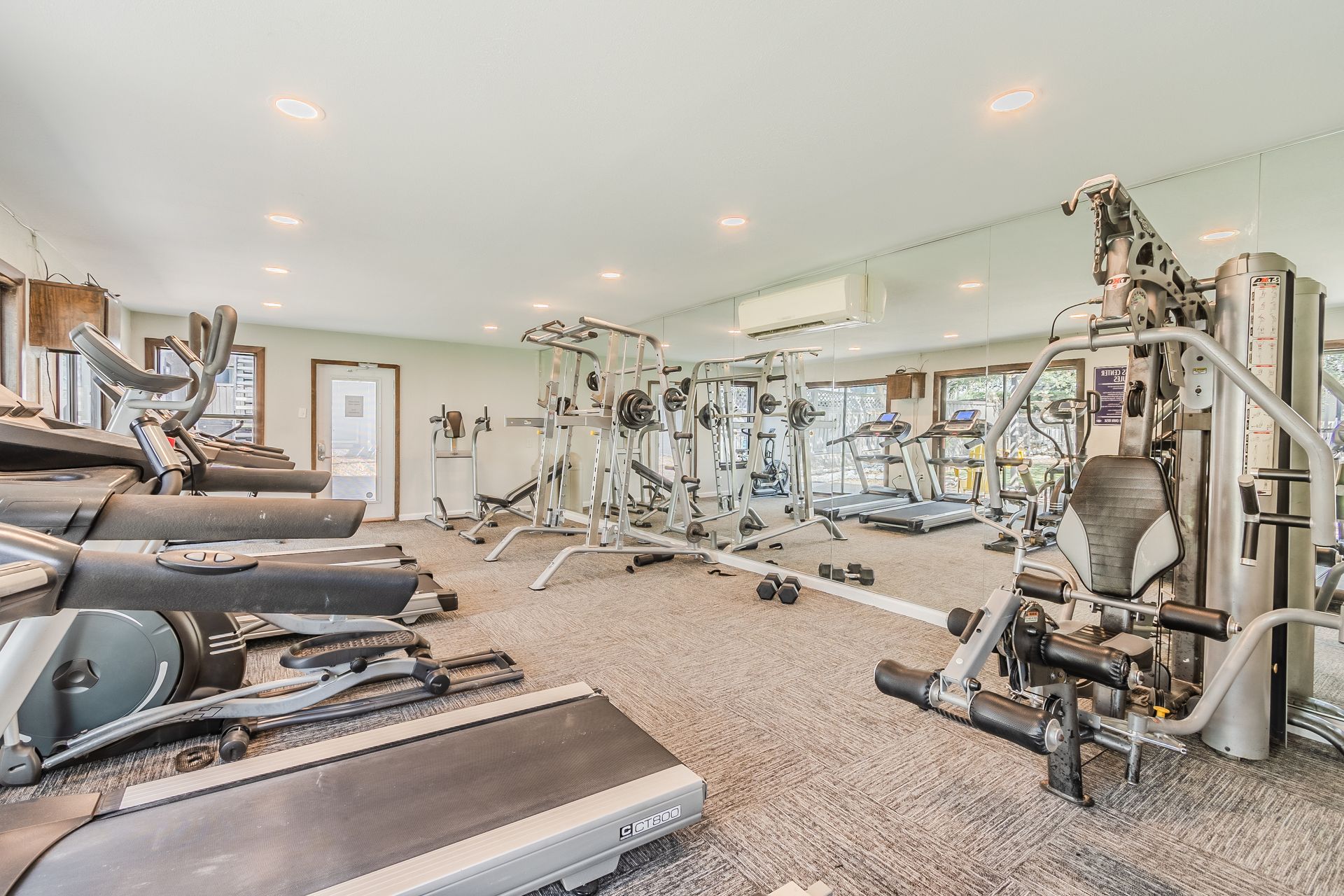 Photo of a community gym, showing showing a large mirror