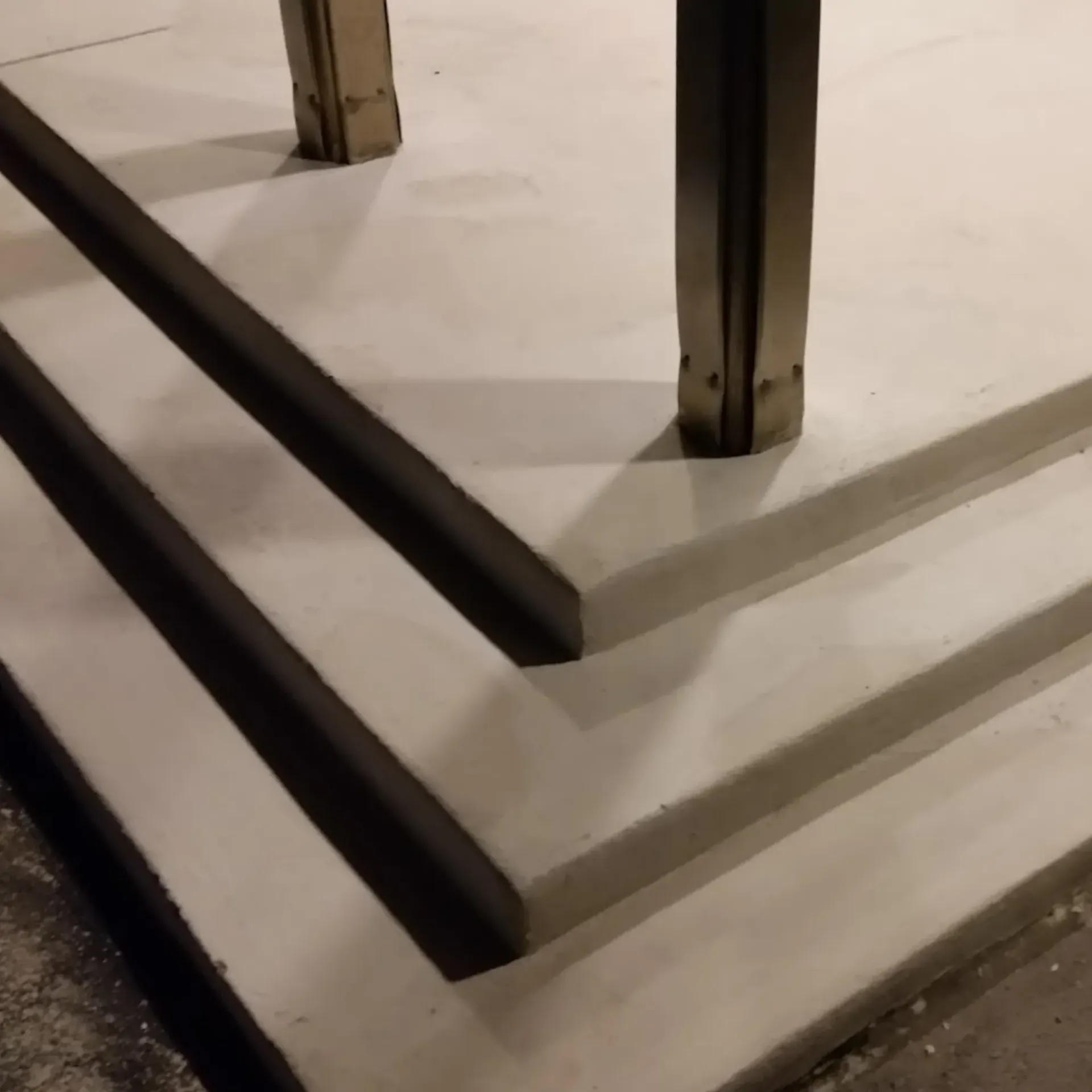 CK Maintenance LLC - A set of concrete stairs with a metal railing