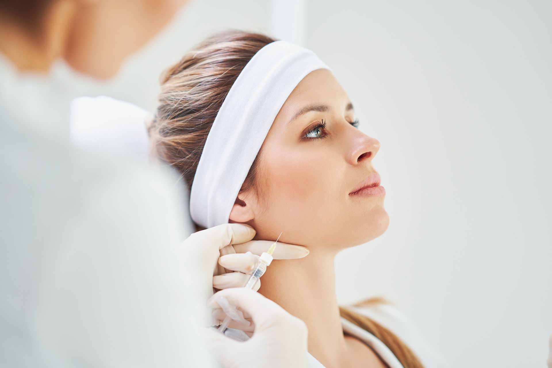 woman getting face injection