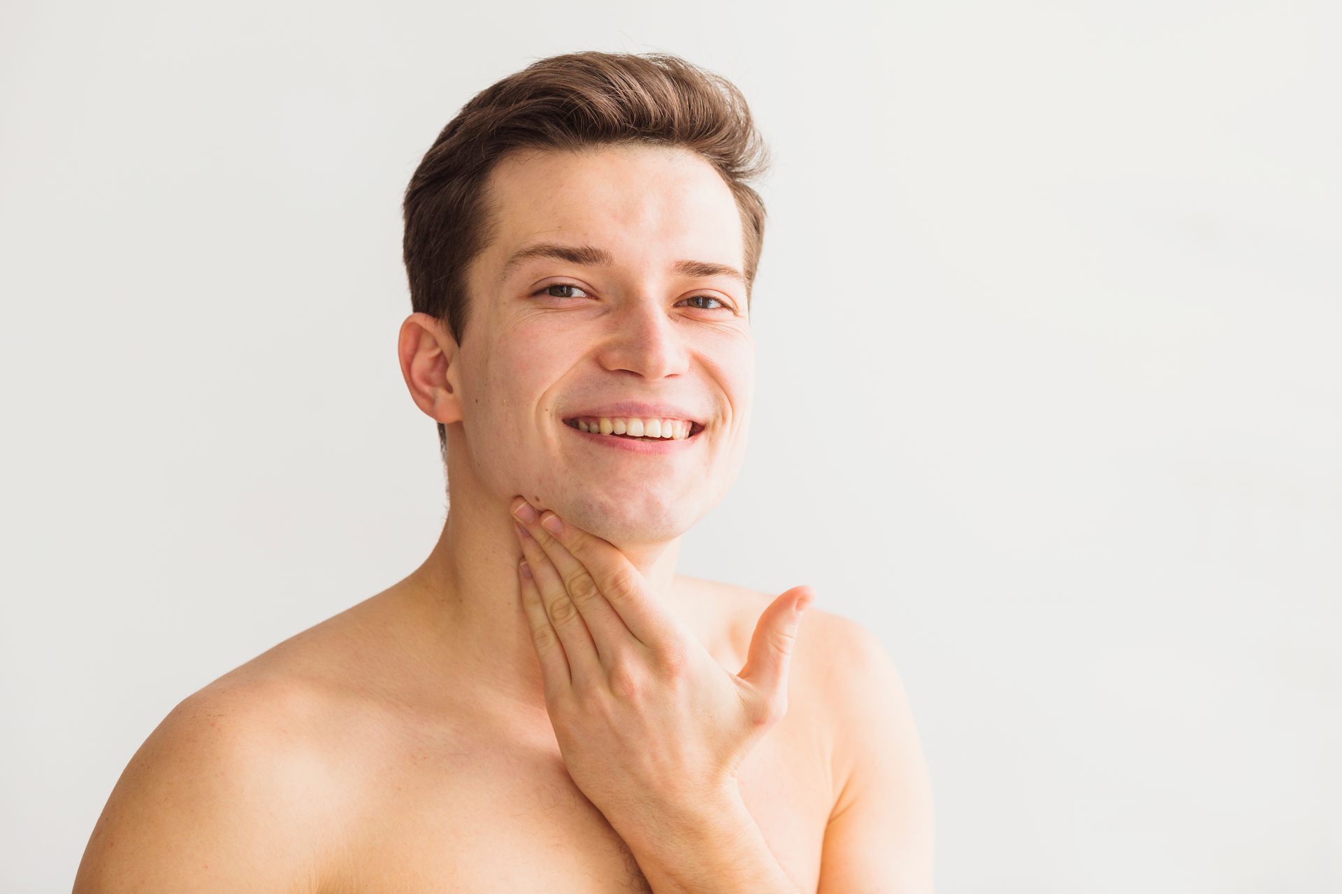 man with smooth torso and face