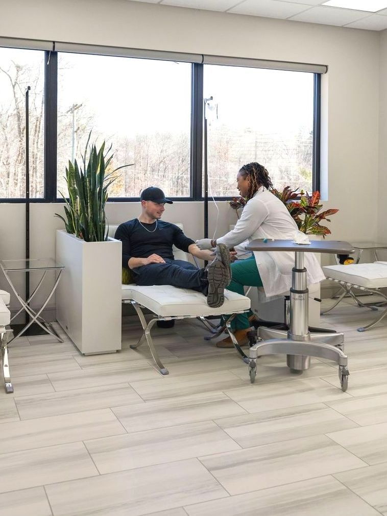 an NP Xperience provider administers IV hydration therapy to male patient 
