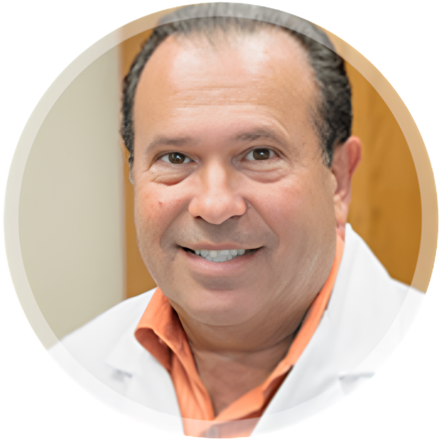 Smiling man in a white coat with orange shirt, posed in a circular portrait
