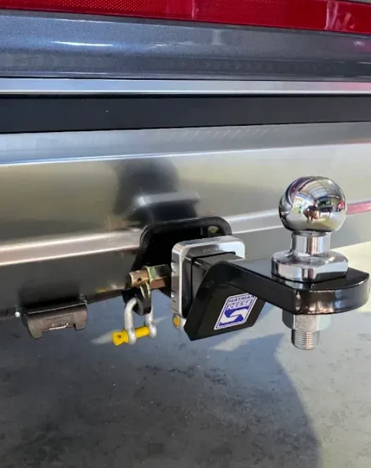 Close-up of a Trailer Hitch Attached to the Back of a Vehicle — Hinterland Towbars in Southside, QLD