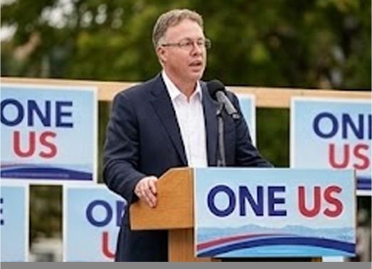Man speaking at a podium with