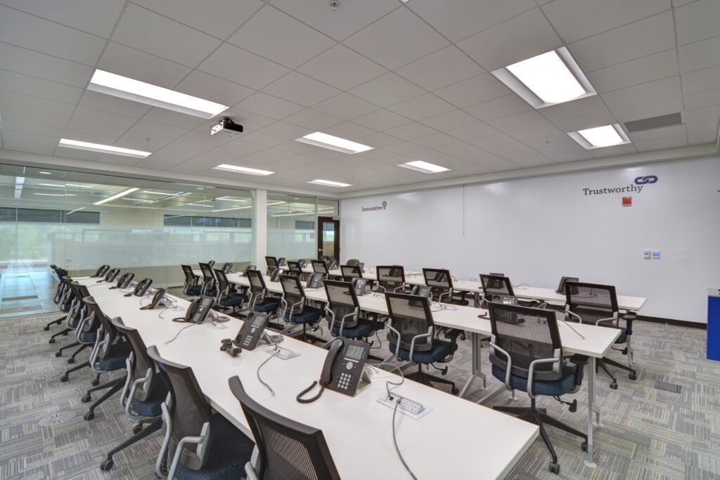 A conference room with a long table and chairs