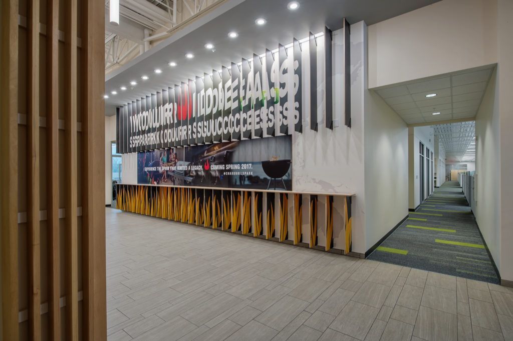 A hallway in a building with a large sign on the wall.