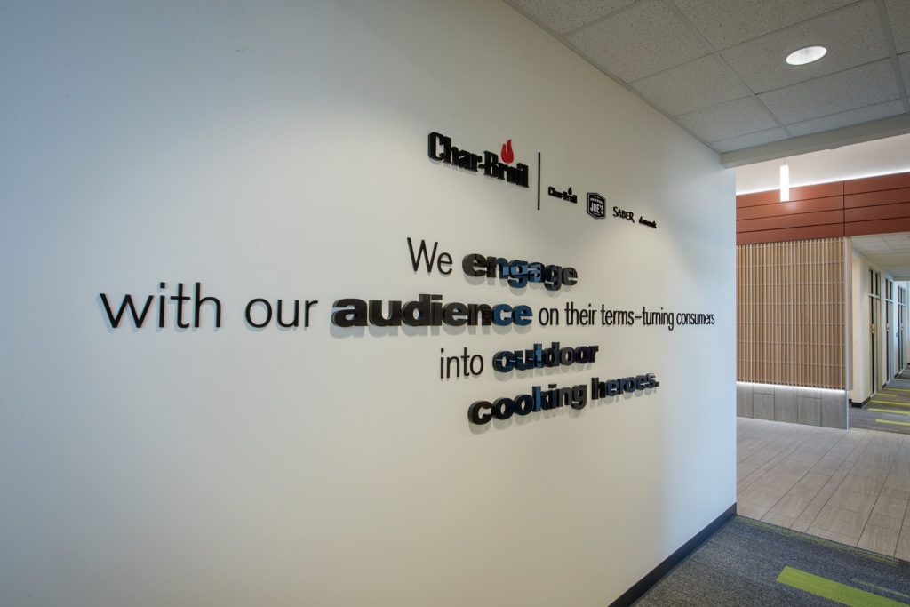 A wall that says we engage with our audience on it