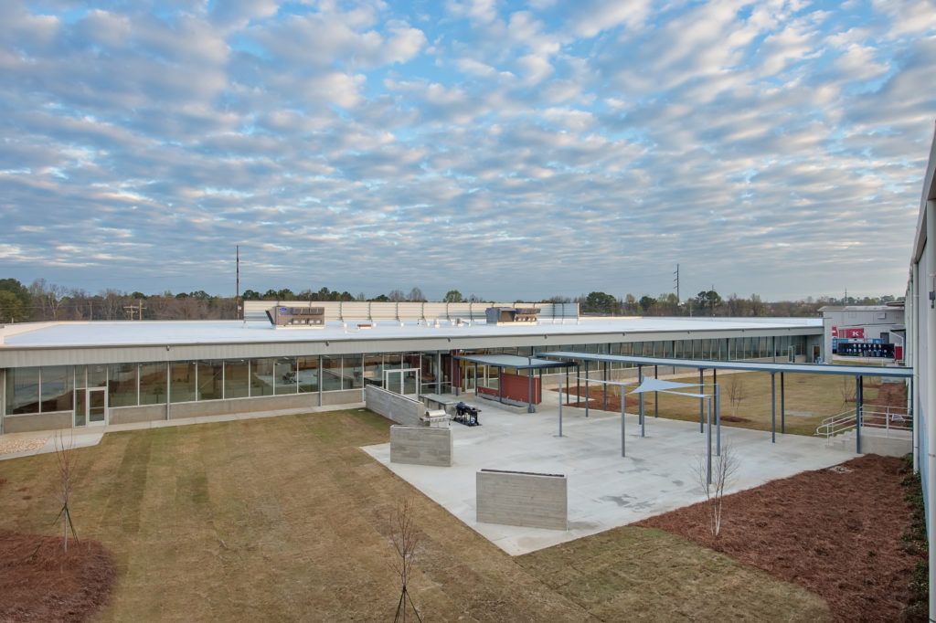 A large building with a lot of windows is being built.