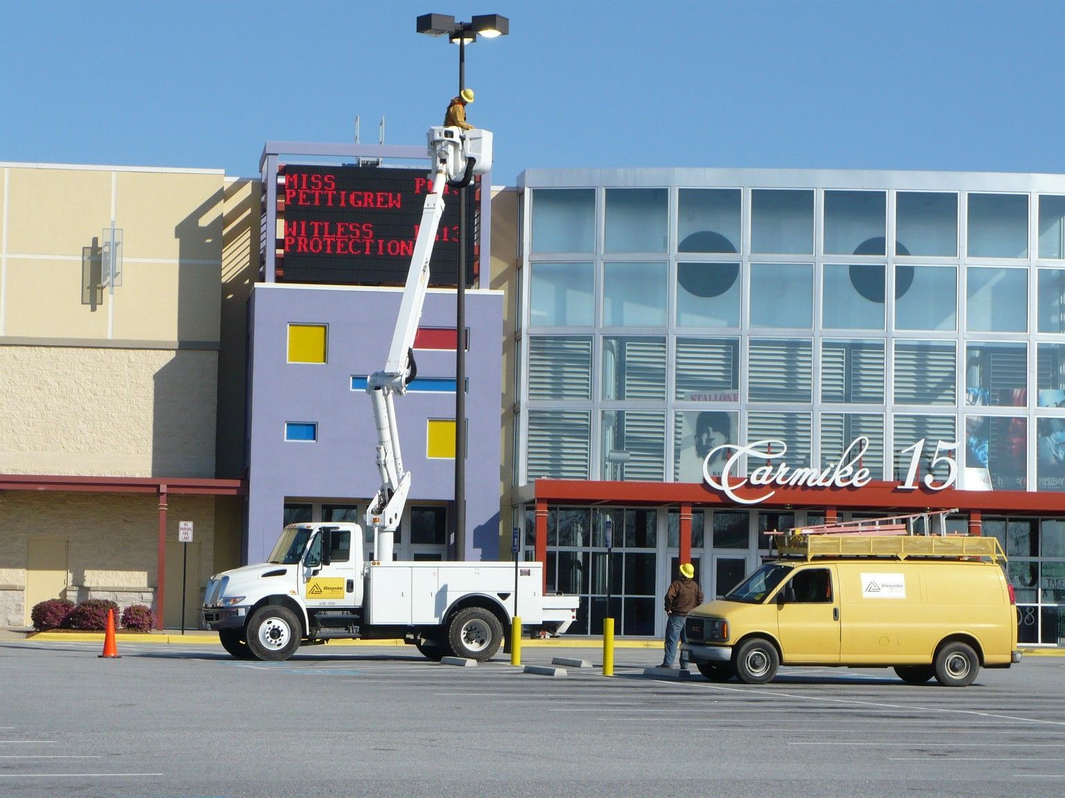 A yellow van is parked in front of carmelo 15