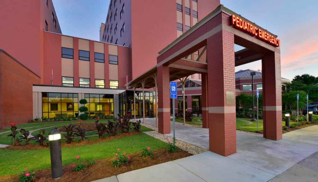 A large brick building with a sign that says pediatric emergency