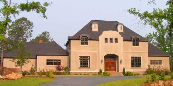 A large house with a driveway leading to it
