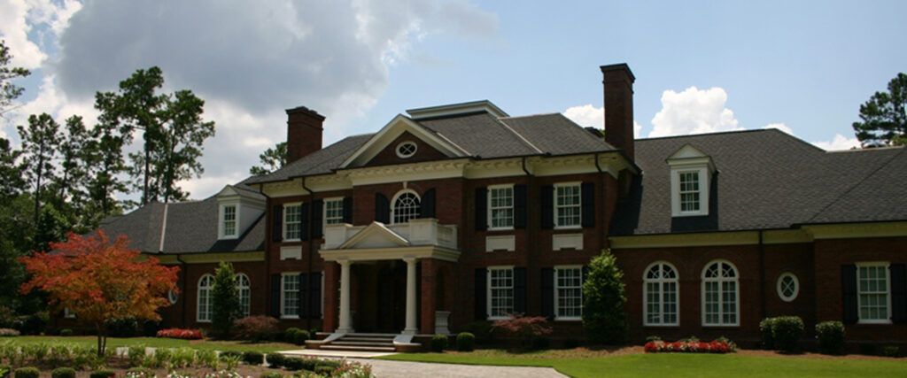 A large brick house with a gray roof
