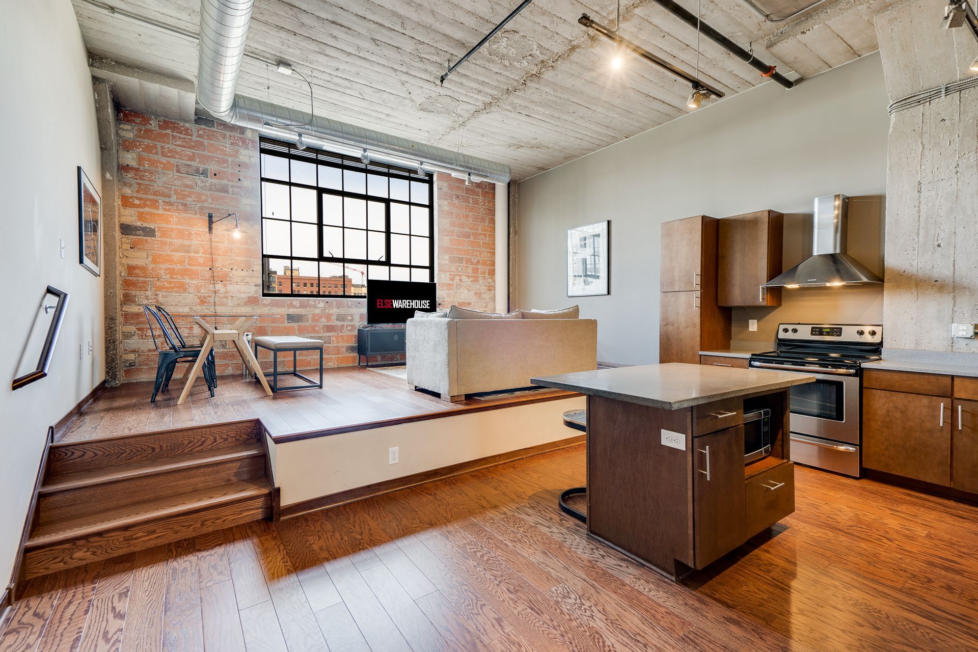 A kitchen with a large island in the middle of the room.